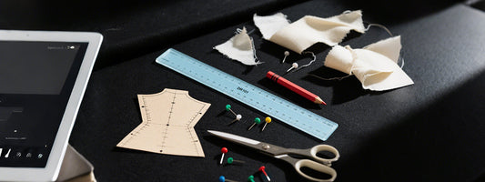 What essential tools are needed for creating a basic dress pattern and sewing a dress?